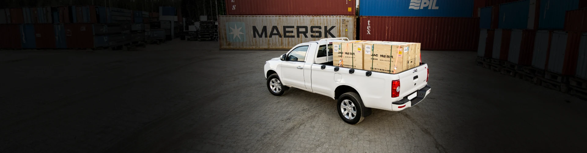 JAC T6 Lux loaded with cargo crates at the container yard